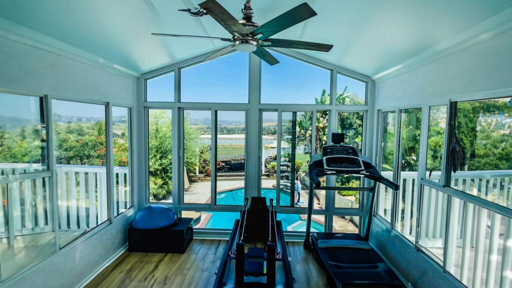 Cathedral-style sunroom with tall windows and a pitched roof