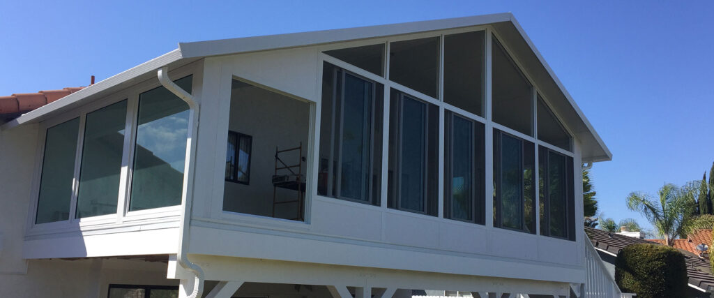 Studio-style sunroom with a low-slope roof and large windows